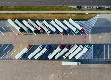 An aerial view of trailers lined up at a distribution facility
