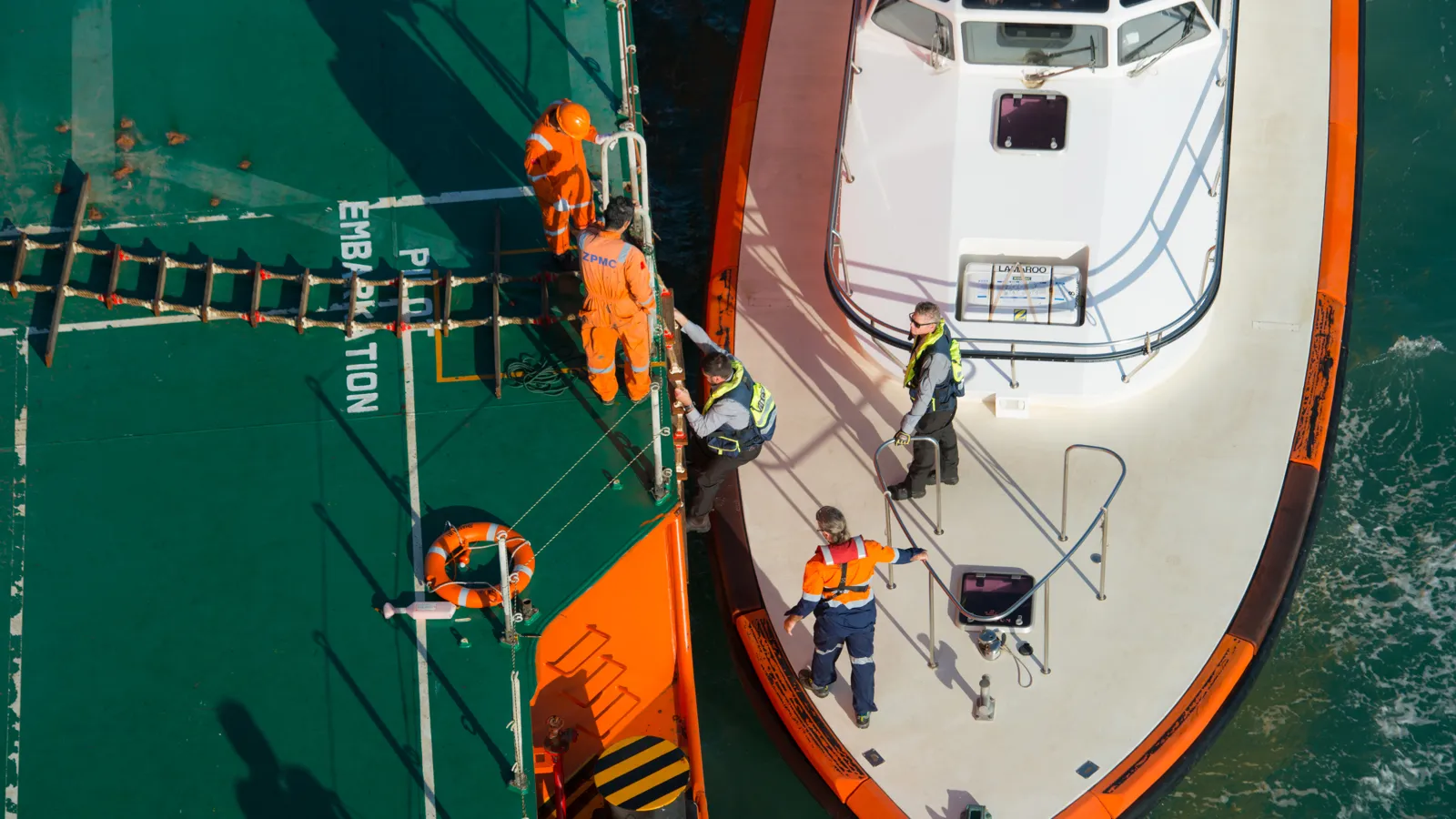 Crew members working on the deck of a vessel.